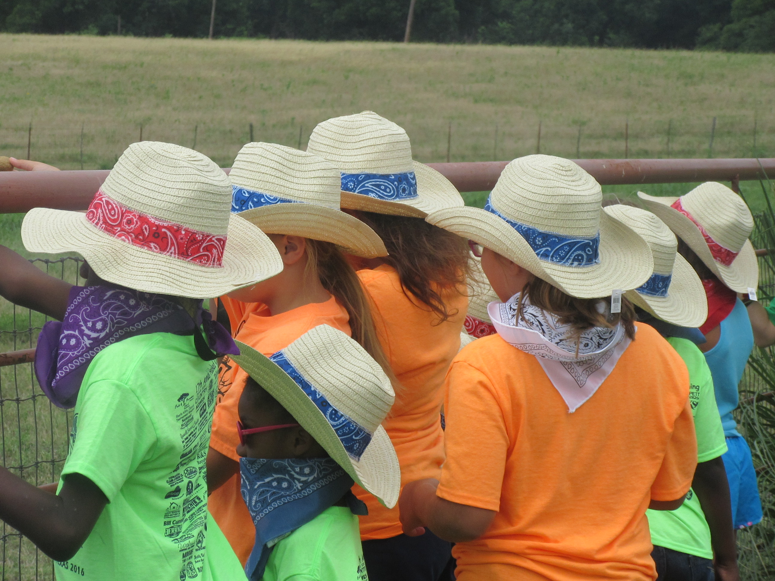 Children wearing hats and bandanas