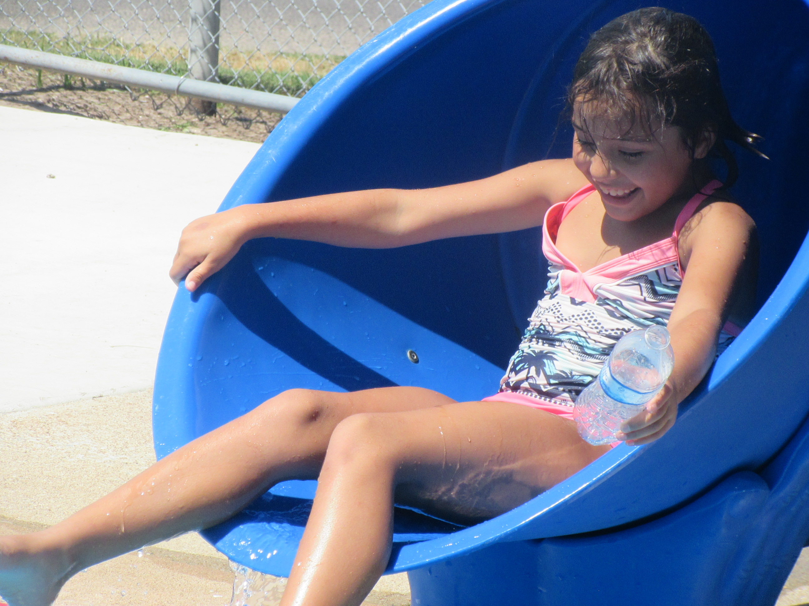 Child using slide at Bunert Pool