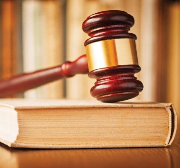 Gavel Placed on top of Book